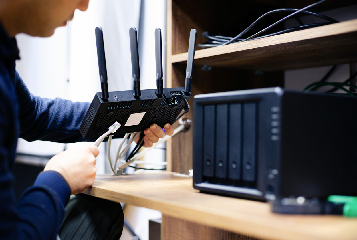 Man Preparing Cables For setting up internet Network